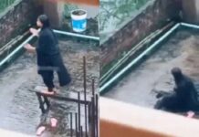 A mobile phone set on a tripod with a broken stool beside it, representing the exact accident moment without showing the girl falling A mobile phone set on a tripod with a broken stool beside it, representing the exact accident moment without showing the girl falling