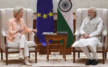 India and EU Ink Landmark Agreement at Summit, Global Trade Impact Expected PM Modi's region-inspired turban was paired with a blue kurta and a Nehru jacket.