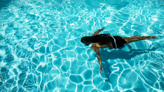 Untitled design - 2026-08-04T180836.302 Can Swimming Pause Your Period? Know The Science Behind The Myth