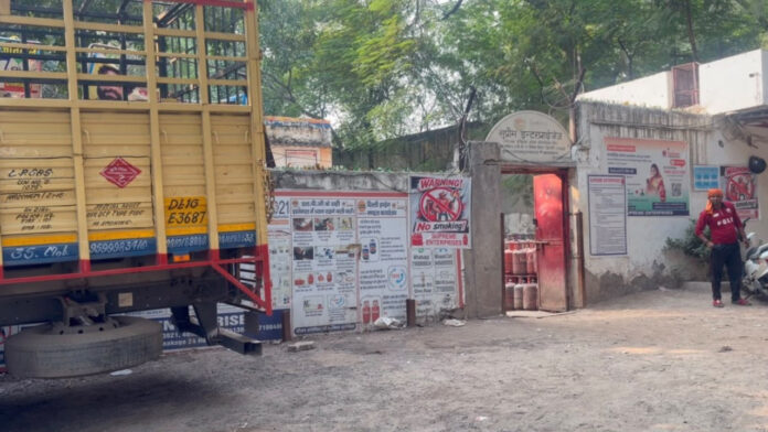 Employee Seriously Injured After Being Trapped Between Two Trucks at Vivek Vihar Gas Agency