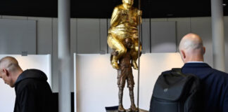 Nude statue of Trump erected near the European Parliament, inscribed 'King of Injustice'